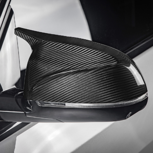 Carbon fiber car mirror cover on a vehicle